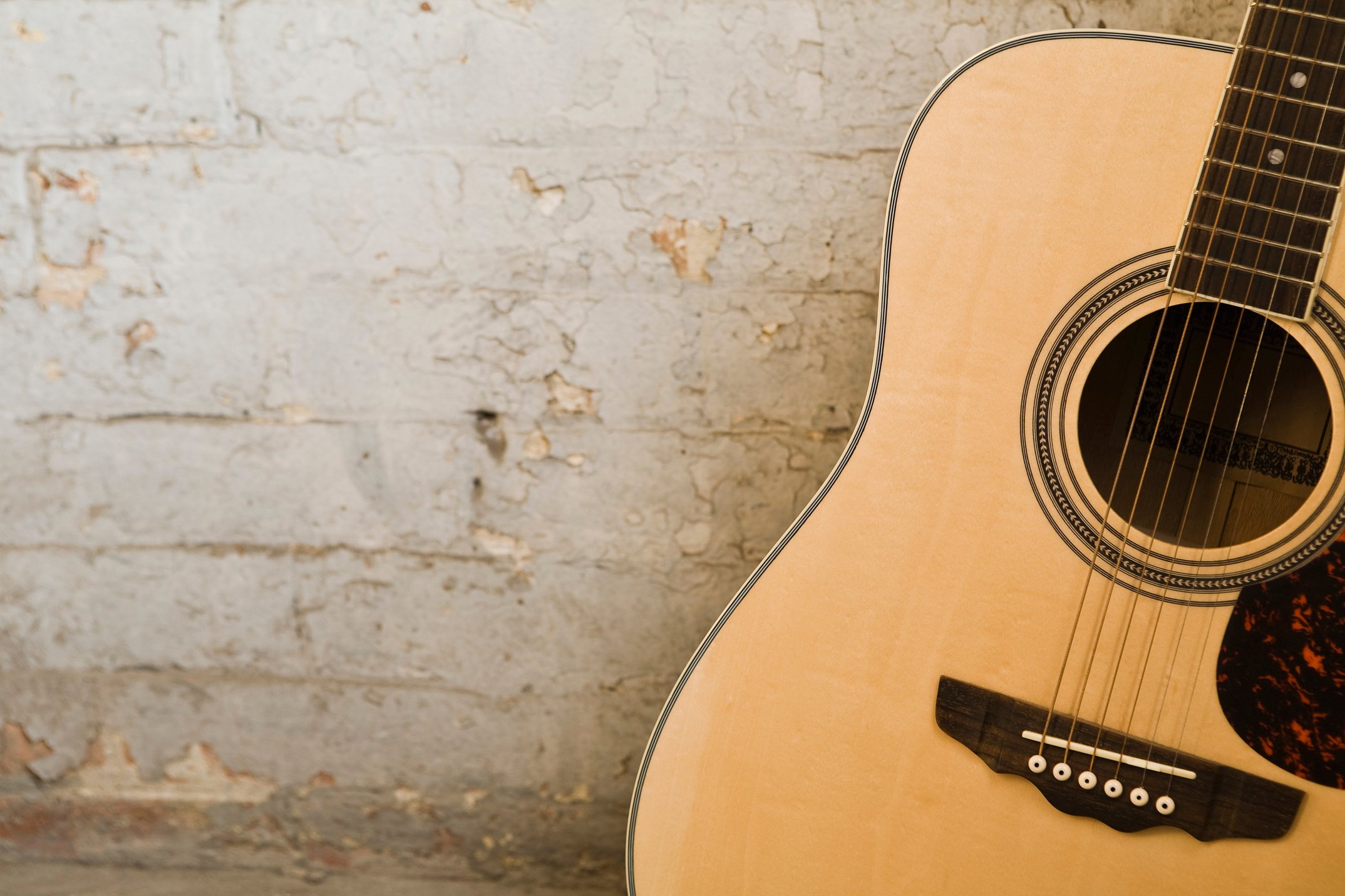 Guitar and brick wall